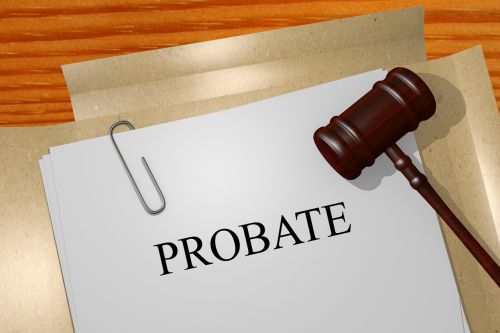 Probate written on paper clipped to document folders with gavel. Probate process, probate law concept.